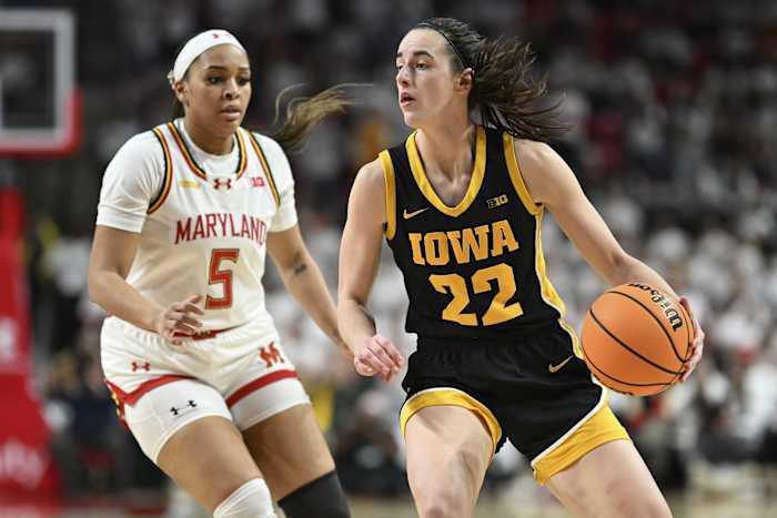 Iowa Hawkeyes guard Caitlin Clark (22) looks to pass as Maryland Terrapins guard Brinae Alexander (5) defends during the fist half at Xfinity Center.